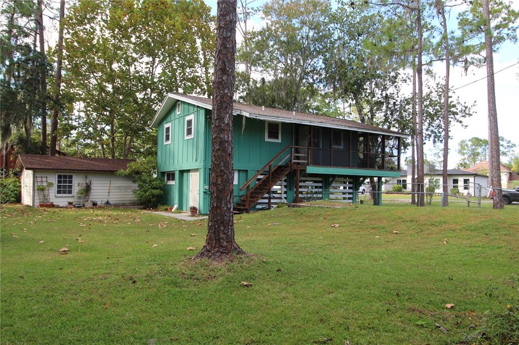 14712 Henson Road Orlando, FL 32832 - Photo 24 of 32 a house view with a sitting space and garden