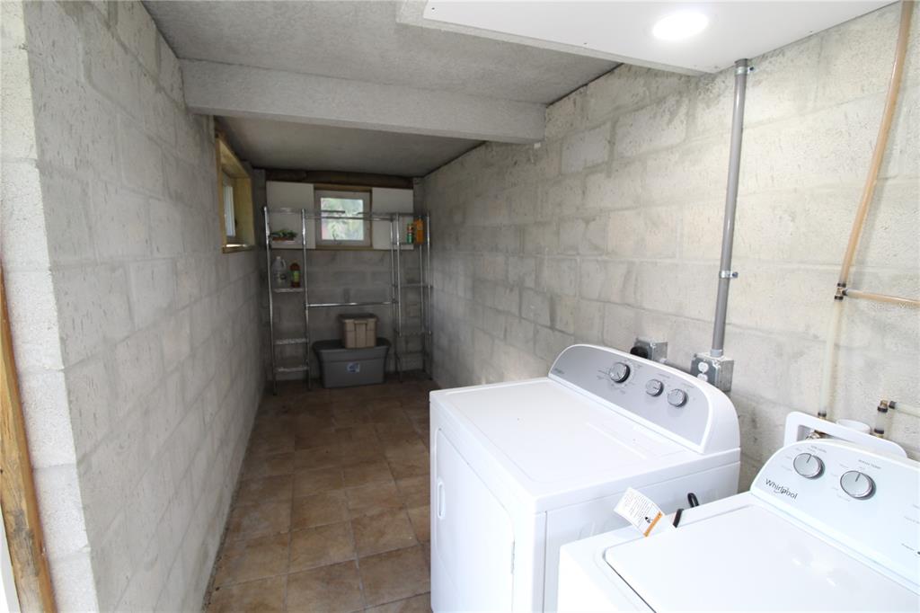 14712 Henson Road Orlando, FL 32832 - Photo 25 of 32 a bathroom with a tub sink and mirror