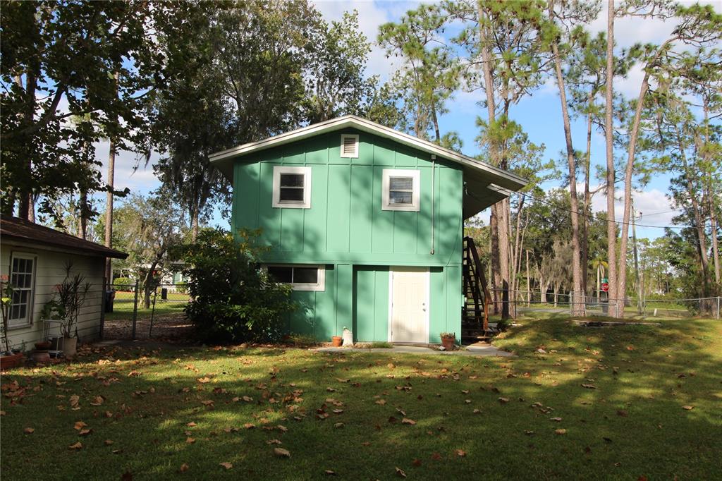 14712 Henson Road Orlando, FL 32832 - Photo 29 of 32 a view of a house with a yard