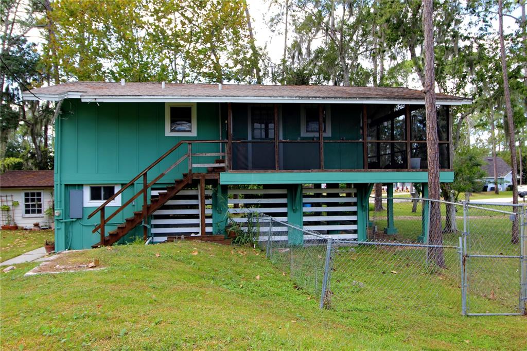 14712 Henson Road Orlando, FL 32832 - Photo 30 of 32 a front view of a house with a yard