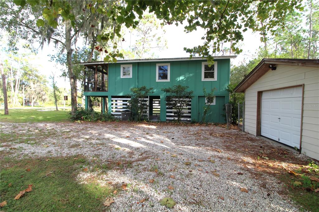 14712 Henson Road Orlando, FL 32832 - Photo 31 of 32 a view of a house with a yard