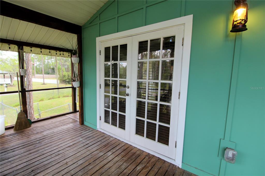 14712 Henson Road Orlando, FL 32832 - Photo 6 of 32 a view of empty room with windows and wooden floor