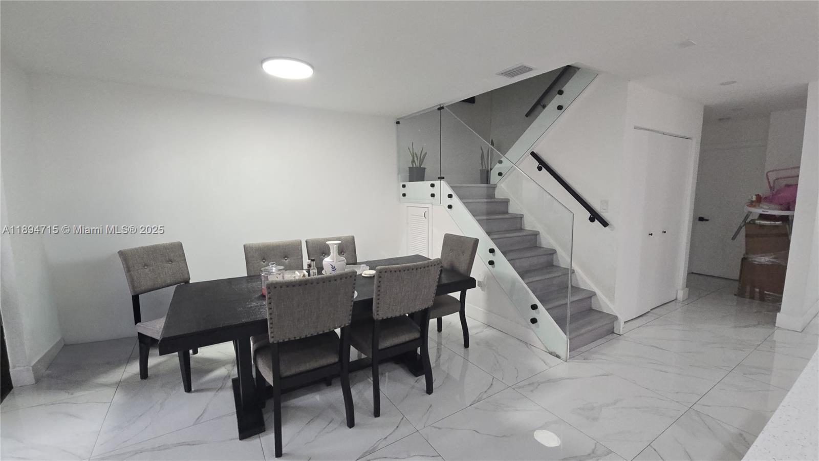 6100 West 26th Court, Unit 10147 Hialeah, FL 33016 - Photo 2 of 15 a view of a dining room with furniture