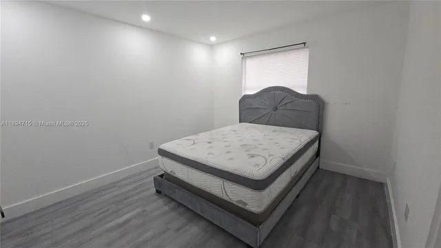 a room with a bed and a window