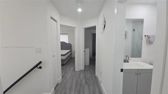 a bathroom with a sink and mirror