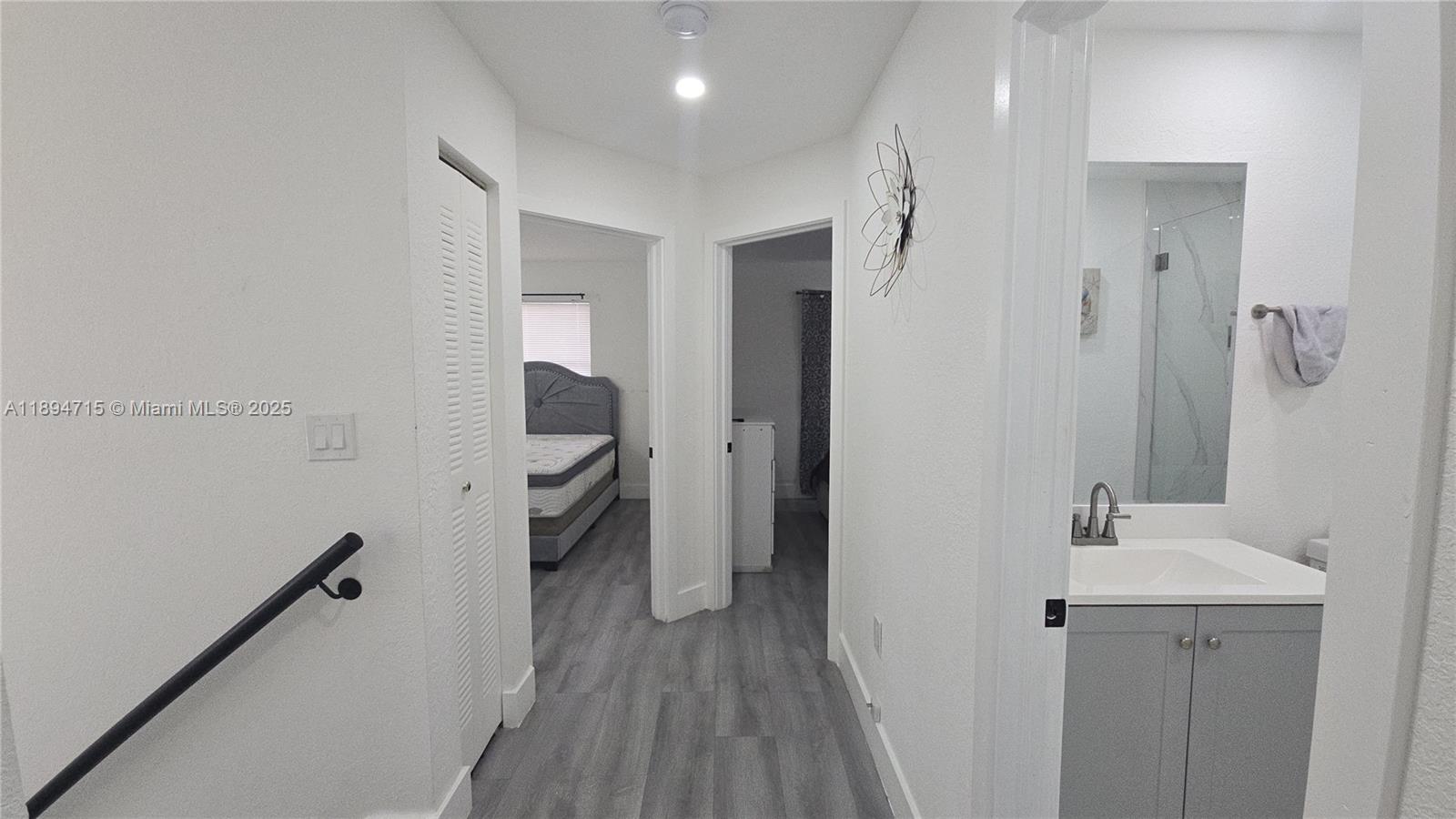 6100 West 26th Court, Unit 10147 Hialeah, FL 33016 - Photo 10 of 15 a bathroom with a sink and mirror