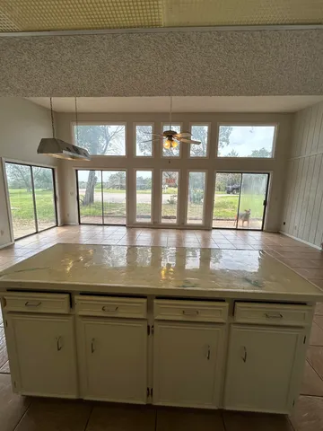 a view of granite countertop cabinets
