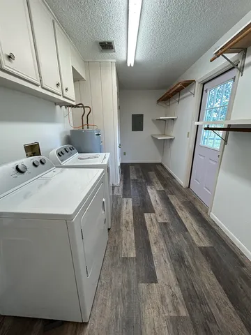 a utility room with cabinets