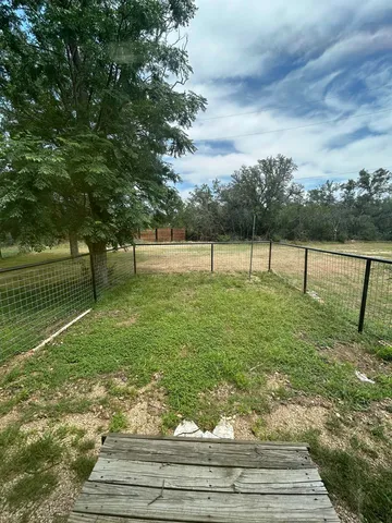 a view of outdoor space with deck and yard