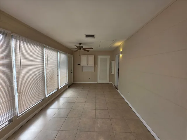 a view of a hallway with an empty room