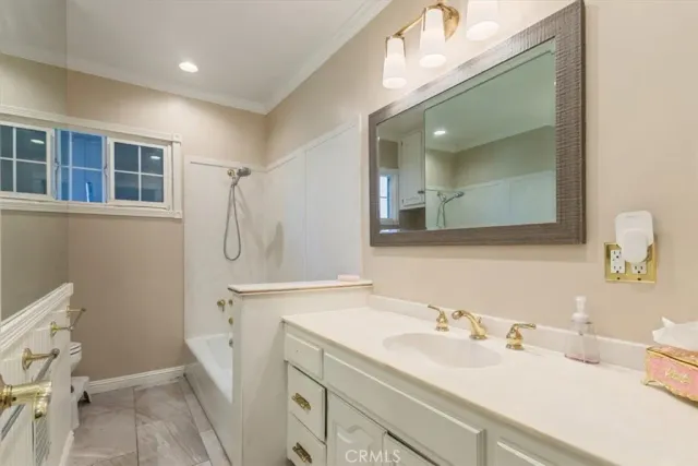 a bathroom with a sink vanity and a mirror