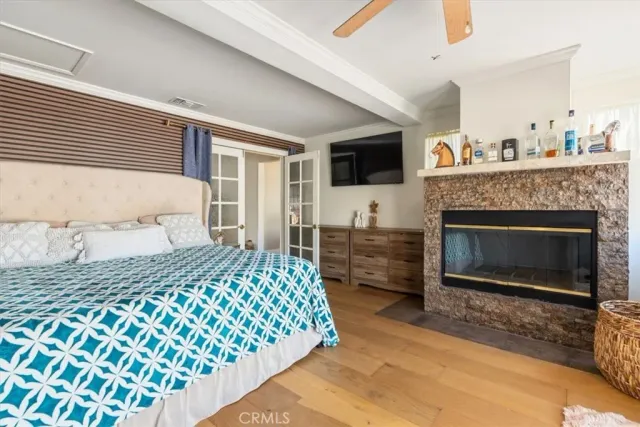 a bedroom with a bed and a fireplace