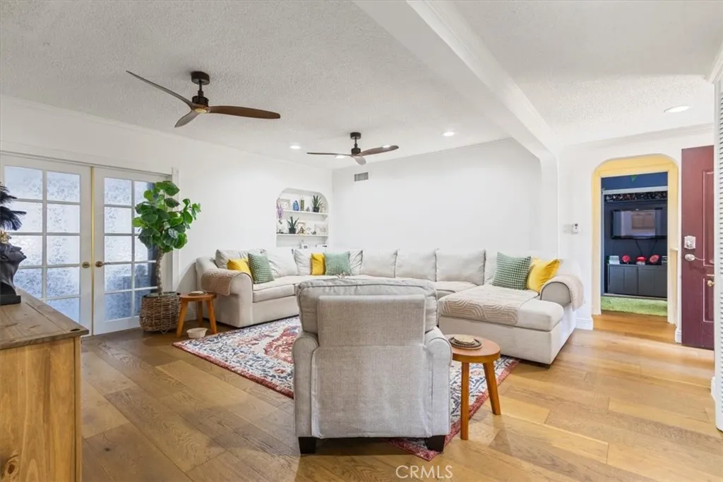 15657 Devonshire Street Granada Hills, CA 91344 - Photo 2 of 39 a living room with furniture and a large window