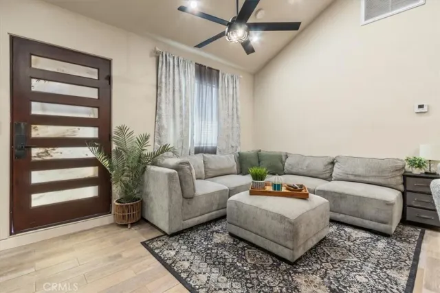 a living room with furniture and a large window