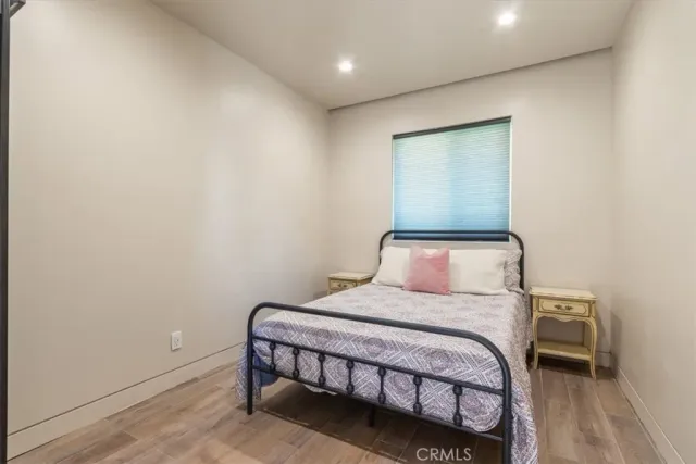 a bedroom with a bed and a table