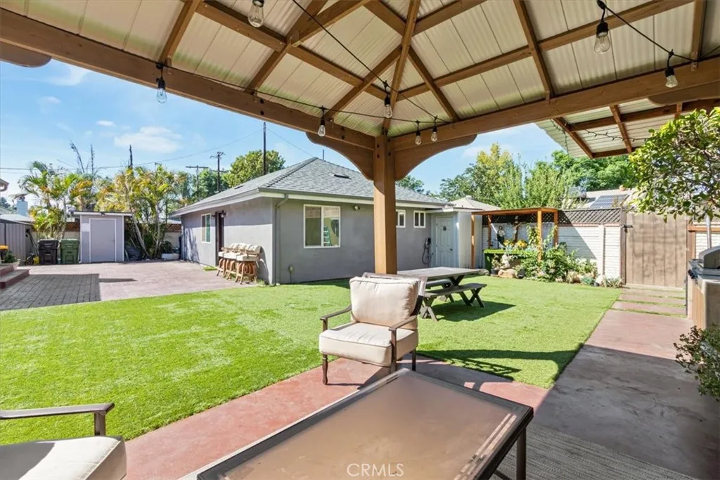 15657 Devonshire Street Granada Hills, CA 91344 - Photo 33 of 39 a front view of a house with garden