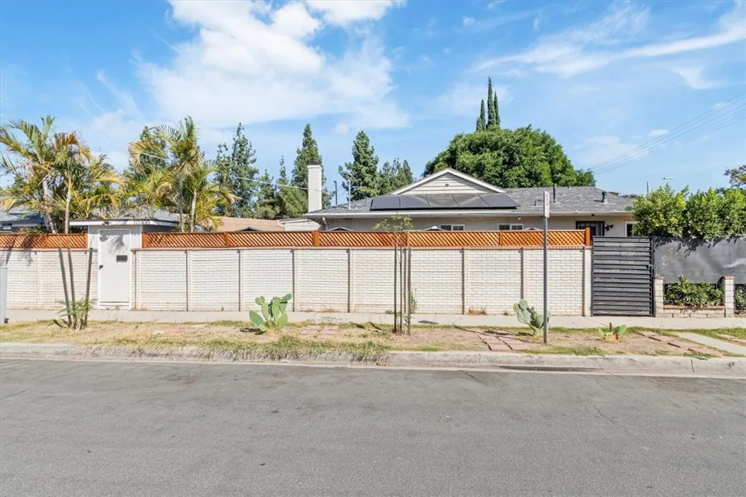 15657 Devonshire Street Granada Hills, CA 91344 - Photo 38 of 39 a house with trees in front of it