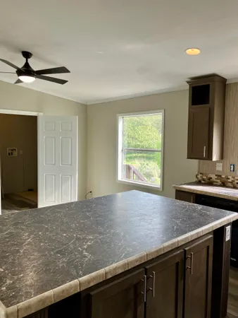 a kitchen with a sink and a window