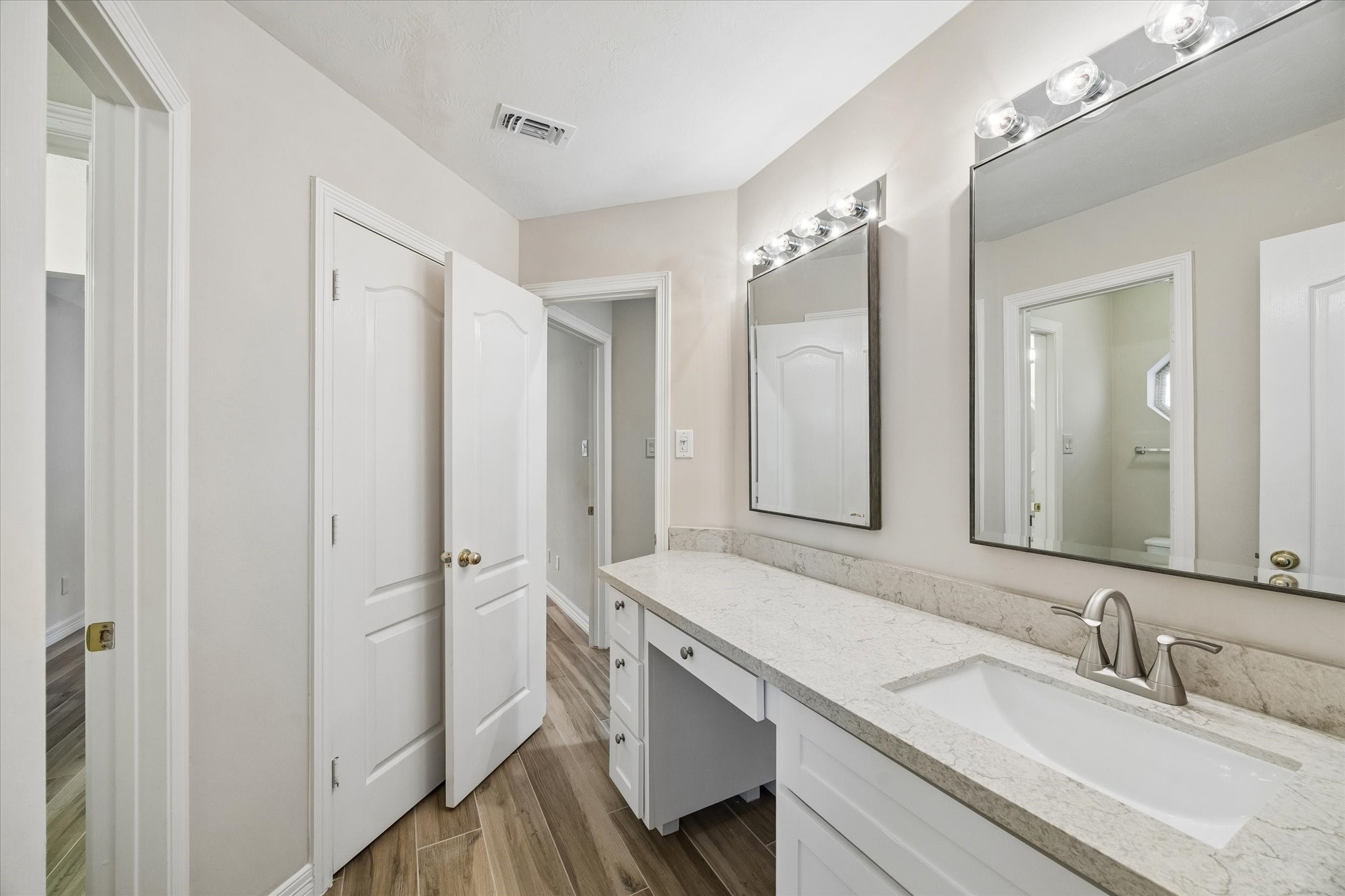 5306 Summerland Ridge Court Houston, TX 77041 - Photo 22 of 33 a bathroom with a double vanity sink mirror and