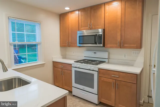 a kitchen with a stove and a microwave