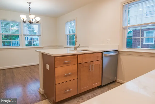 a kitchen with a sink and a window