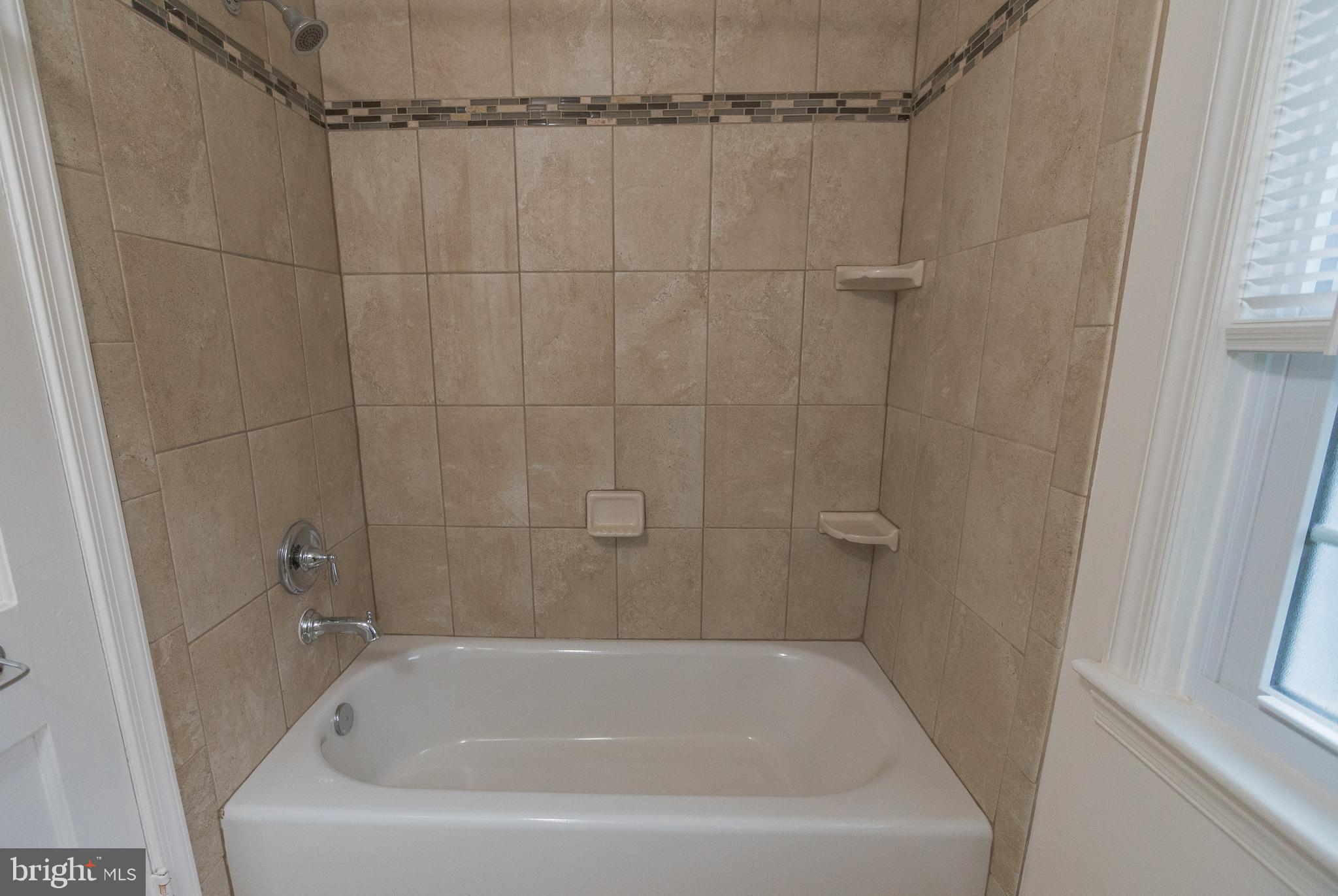 1613 Neely Road Silver Spring, MD 20903 - Photo 25 of 53 a close view of a bathtub in bathroom