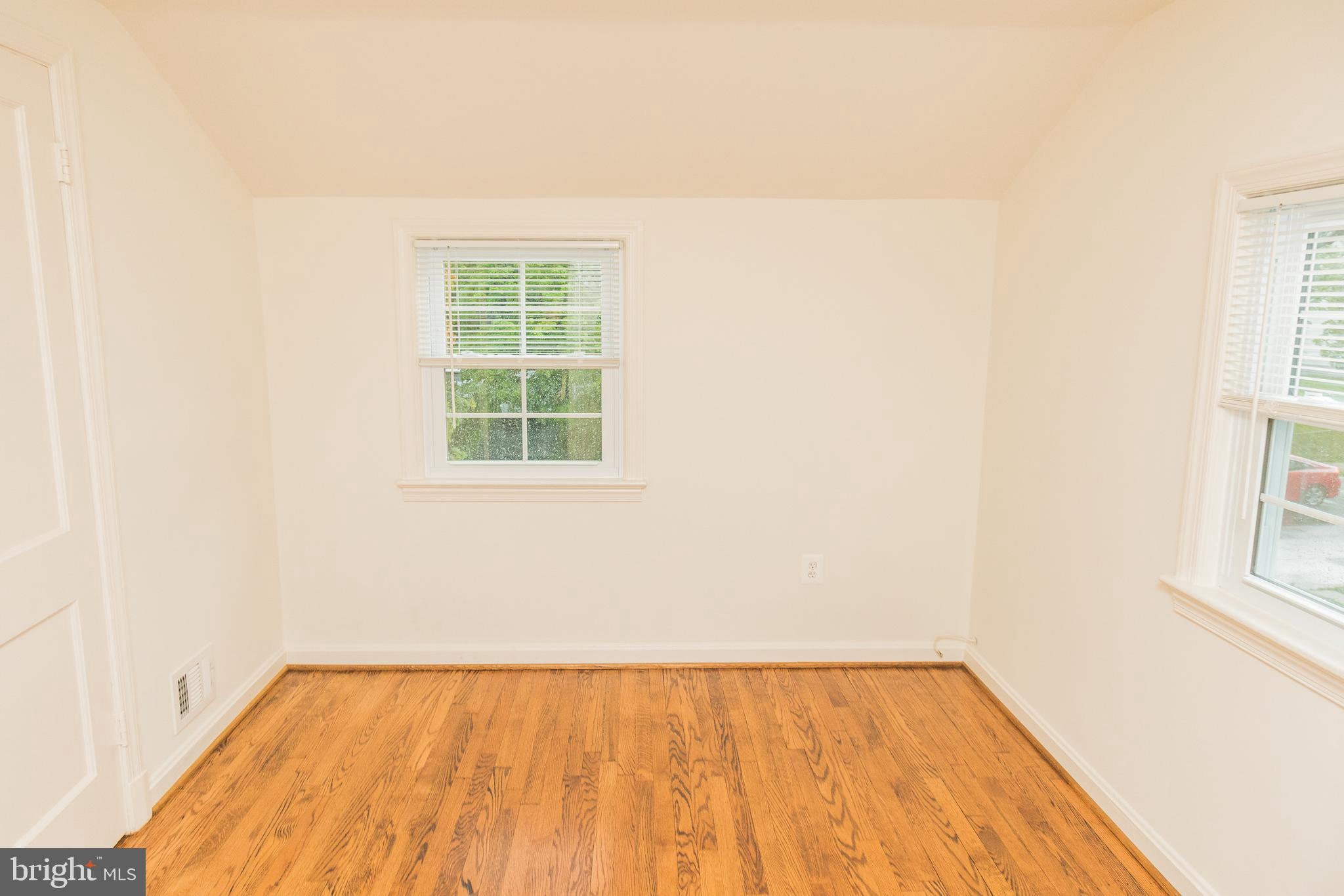 1613 Neely Road Silver Spring, MD 20903 - Photo 26 of 53 a view of a room with wooden floor and a window