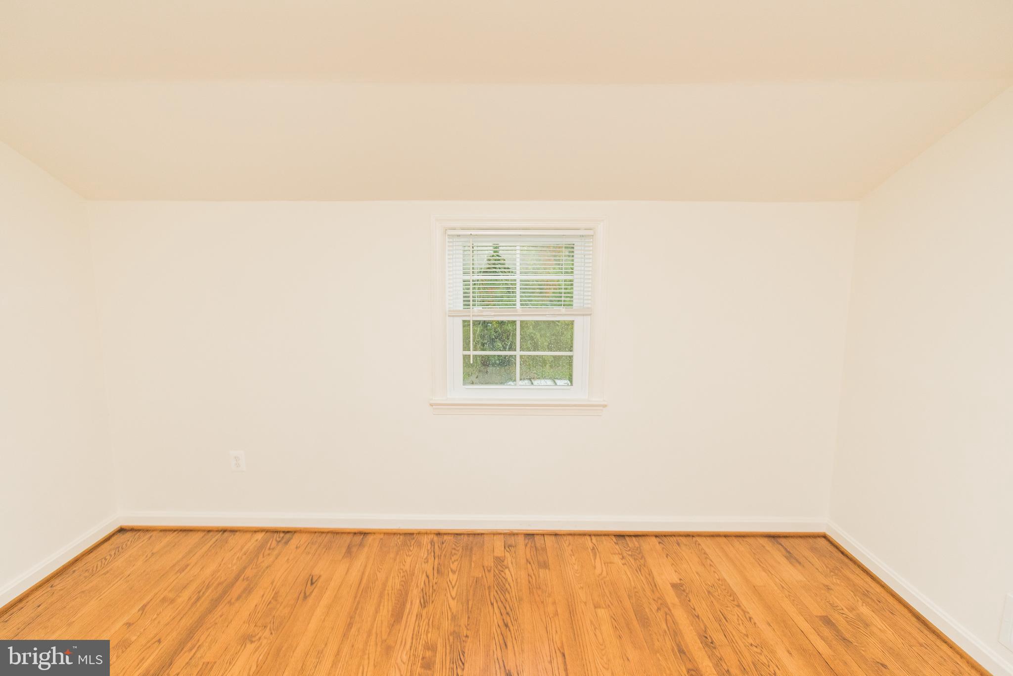 1613 Neely Road Silver Spring, MD 20903 - Photo 35 of 53 a view of an empty room with a window