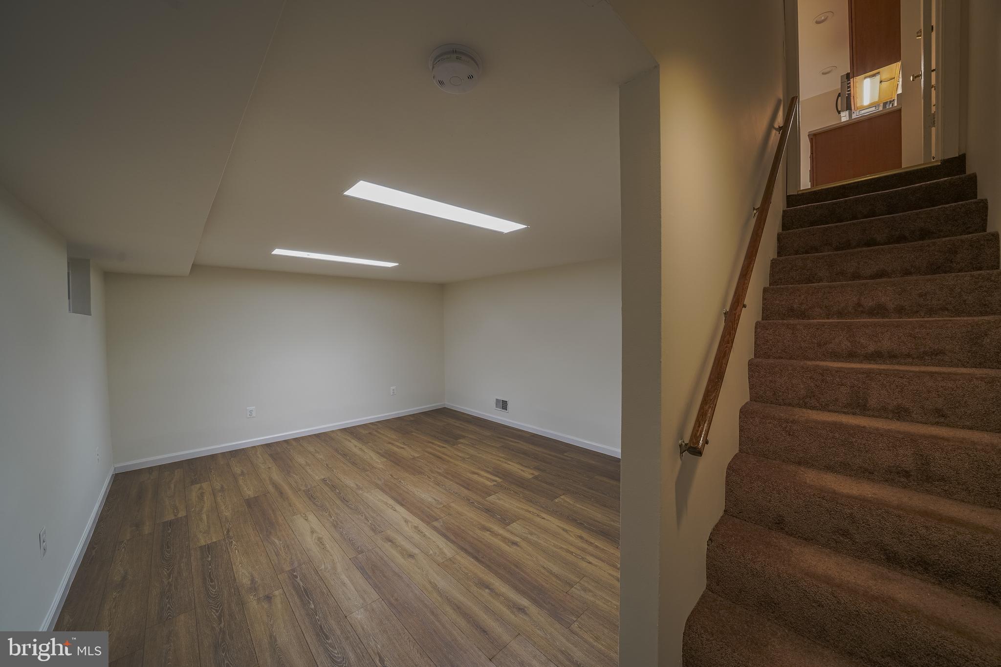 1613 Neely Road Silver Spring, MD 20903 - Photo 38 of 53 a view of an empty room with stairs