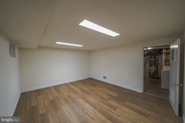 a view of empty room with wooden walls