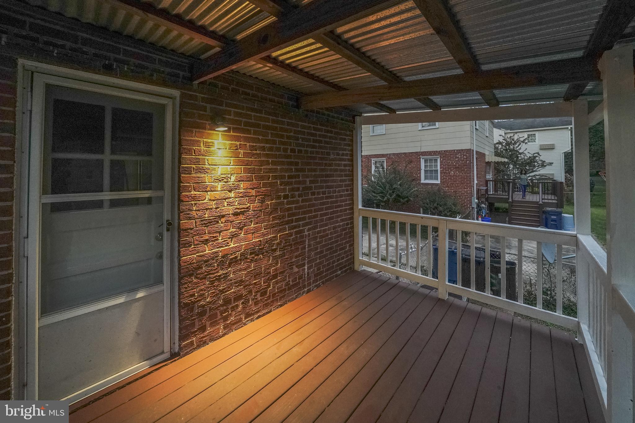 1613 Neely Road Silver Spring, MD 20903 - Photo 46 of 53 a view of balcony with wooden floor