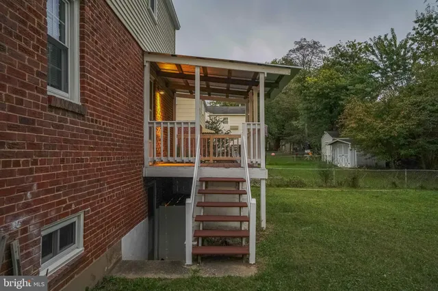 a front view of a house with a garden and out door