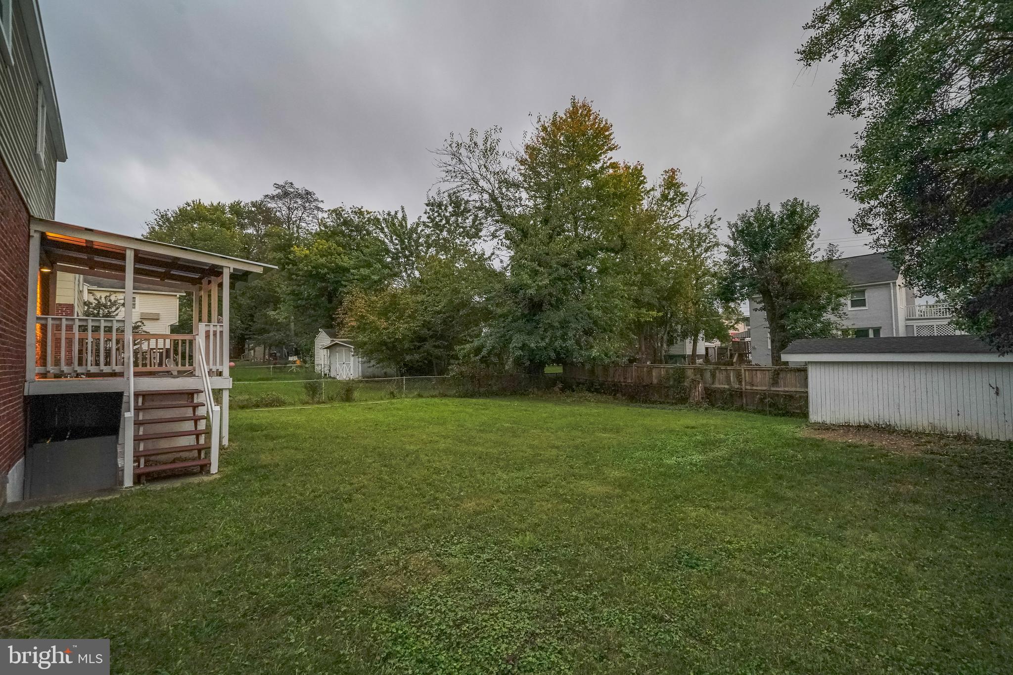 1613 Neely Road Silver Spring, MD 20903 - Photo 49 of 53 a backyard of a house with lots of green space