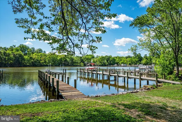 a view of a lake with houses with outdoor space