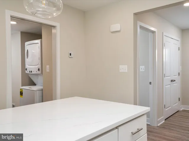 a bedroom with a bed and a night stand