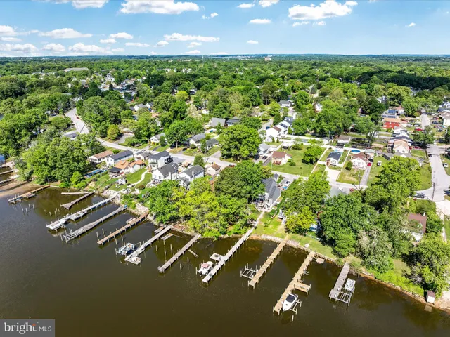 a view of a lake with a house swimming pool and outdoor space