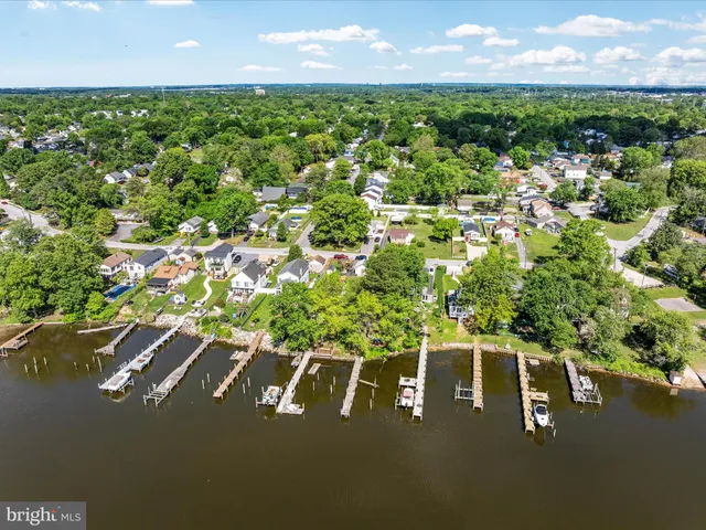 an aerial view of a house with garden space and sitting area