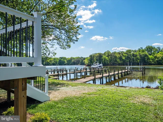 a view of a house with backyard and a patio