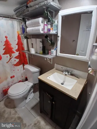 a bath tub sitting next to a bathroom sink