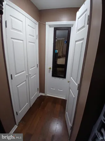 a bathroom with a sink toilet and a mirror