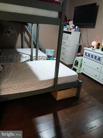 a bedroom with a bed and cabinets