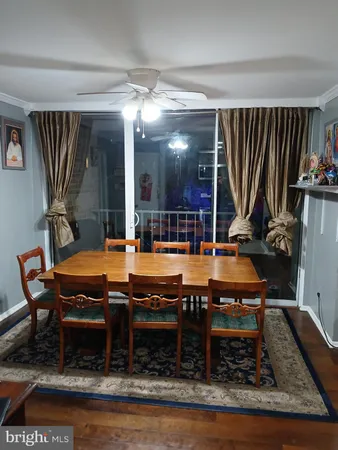 a living room with furniture a rug and a flat screen tv