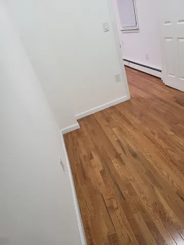 a bathroom with a sink toilet and a mirror