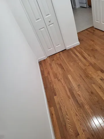 a view of balcony with wooden floor