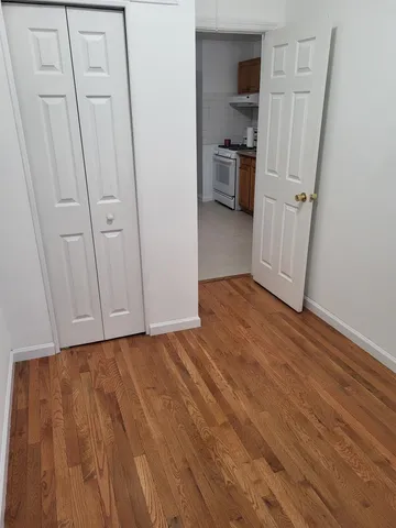 a kitchen with a stove sink and cabinets
