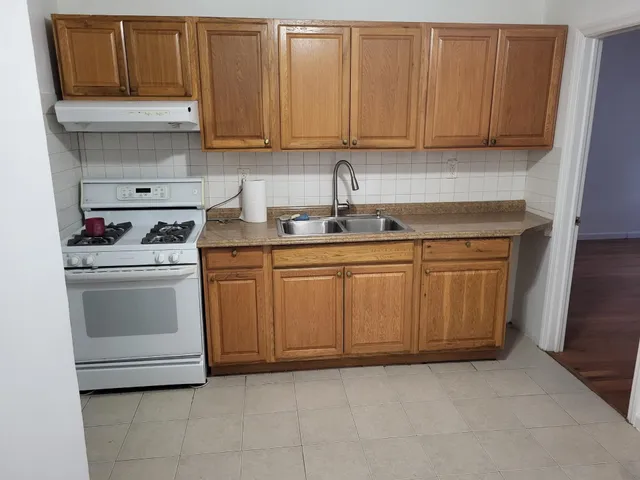 a kitchen with a stove and a sink