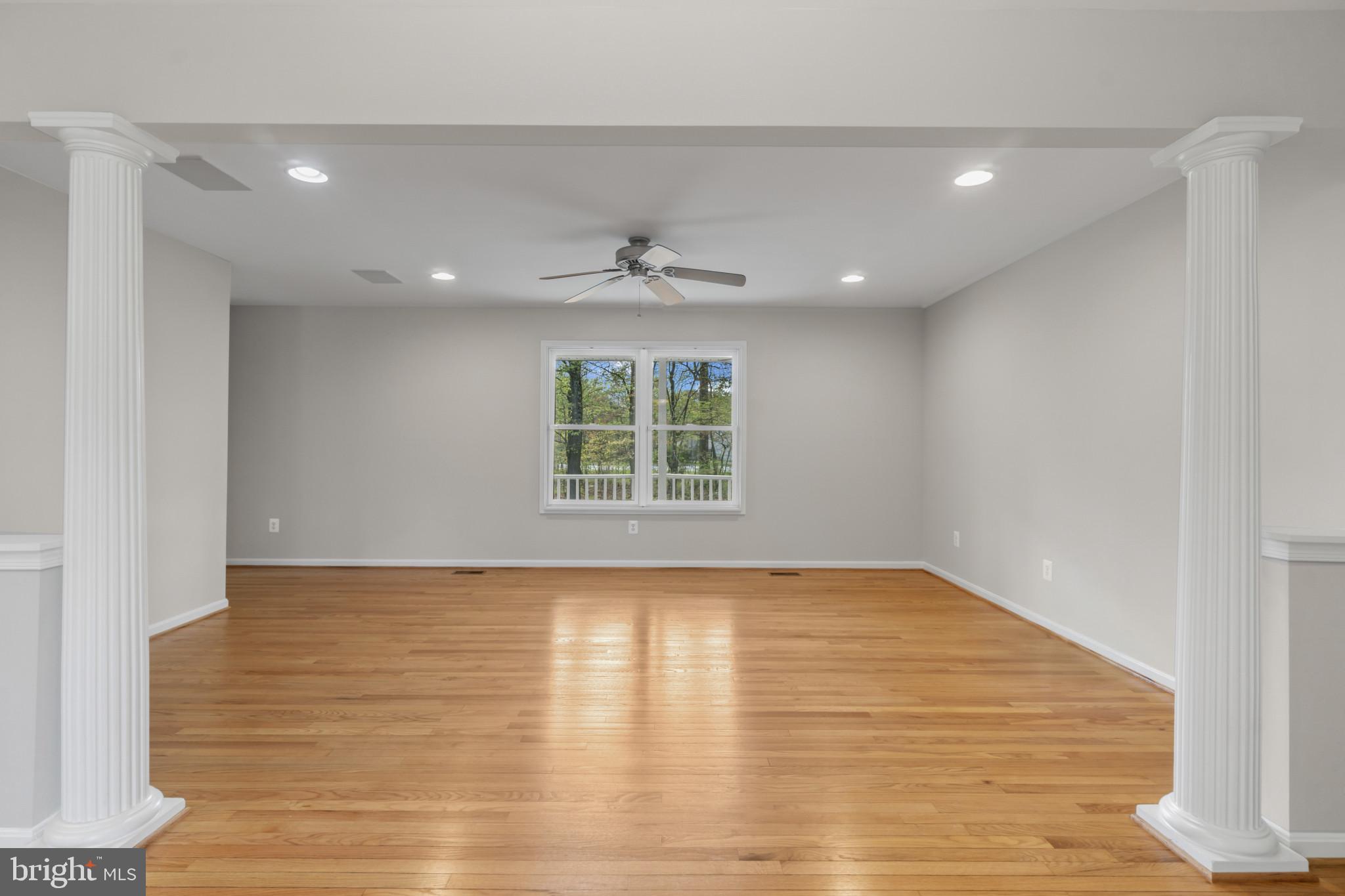 1609 Turkey Point Road Essex, MD 21221 - Photo 15 of 41 a view of an empty room with wooden floor and a window