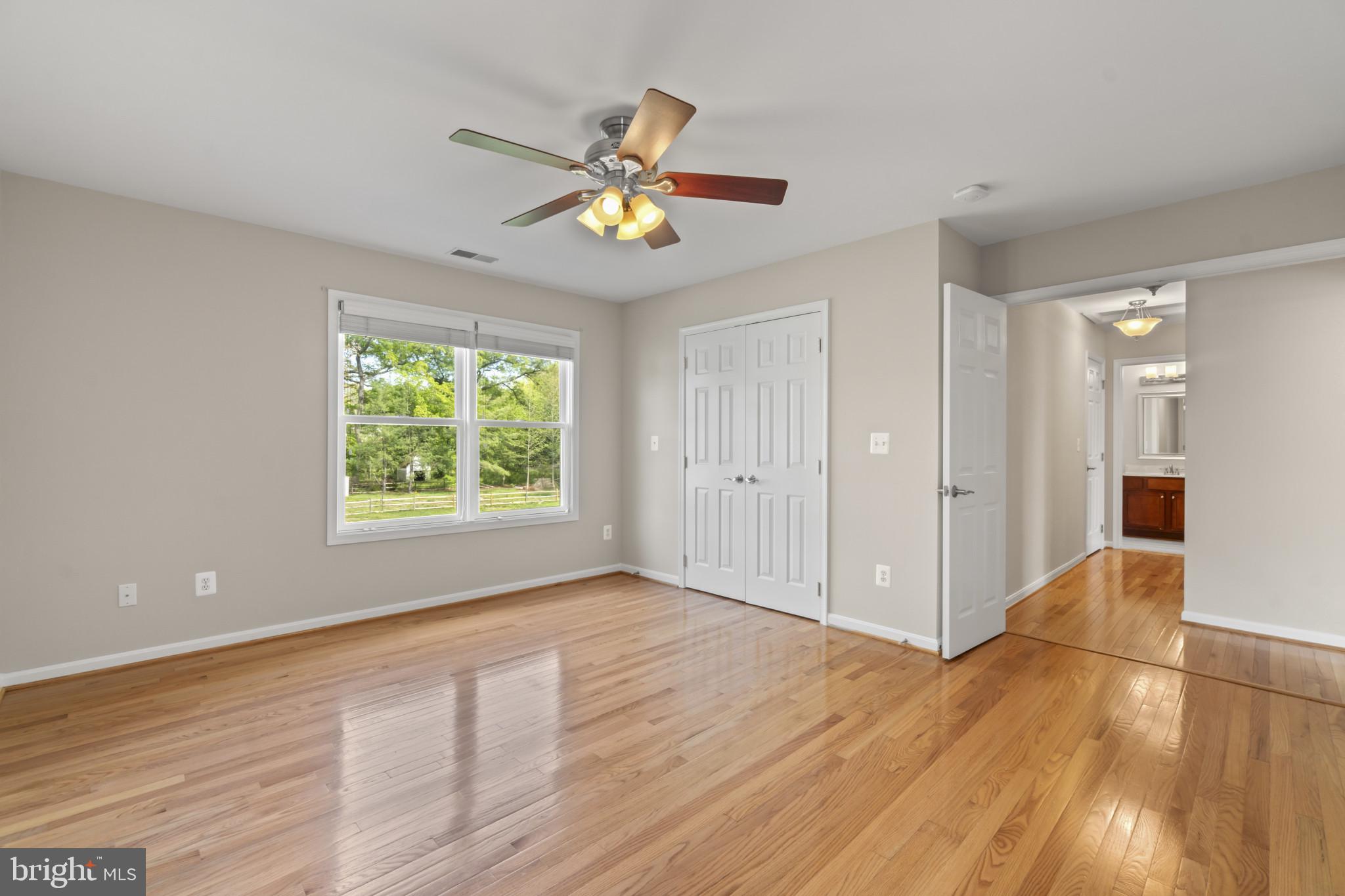 1609 Turkey Point Road Essex, MD 21221 - Photo 17 of 41 a view of an empty room with window and wooden floor