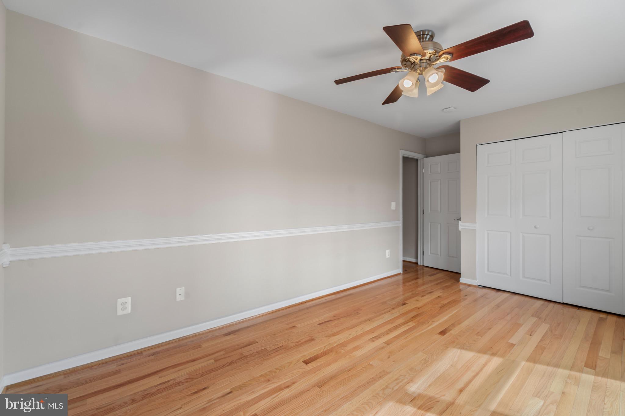 1609 Turkey Point Road Essex, MD 21221 - Photo 27 of 41 an empty room with wooden floor and windows