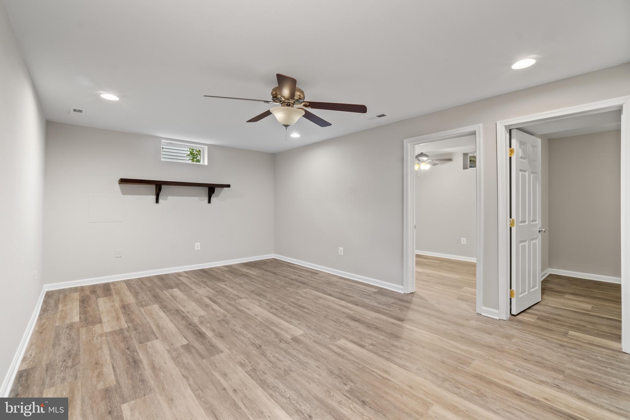 1609 Turkey Point Road Essex, MD 21221 - Photo 29 of 41 wooden floor in an empty room with a window